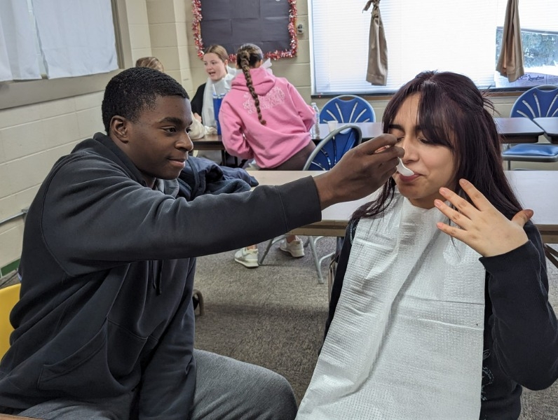 Student feeding the other